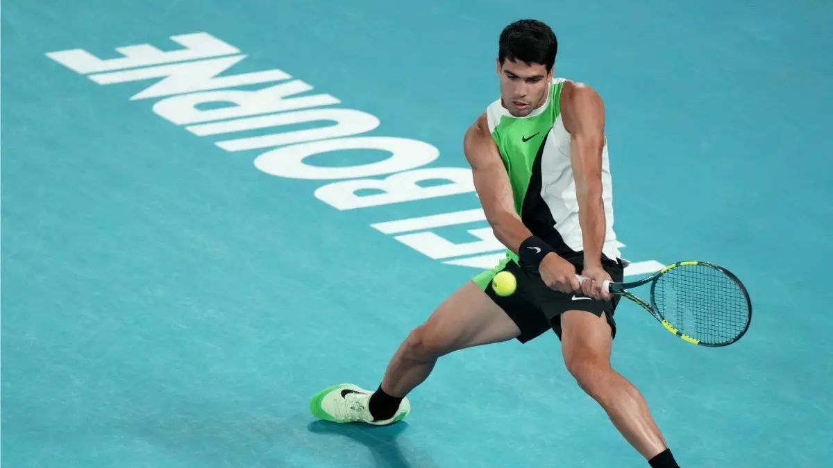 Carlos Alcaraz Clinches Maiden Australian Open Title, World No. 1 Breaks Idol Rafael Nadal's Historic Milestone Carlos Alcaraz in action against Novak Djokovic