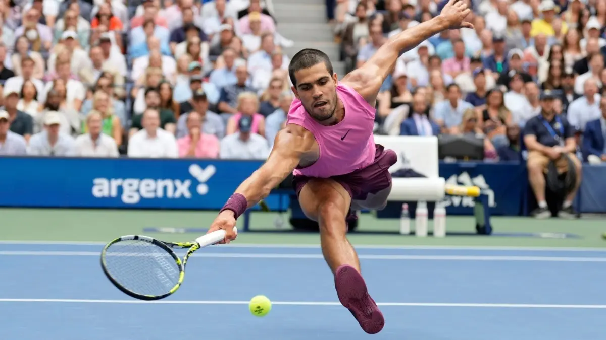 Carlos Alcaraz in action against Novak Djokovic in the US Open 2025 semi-final