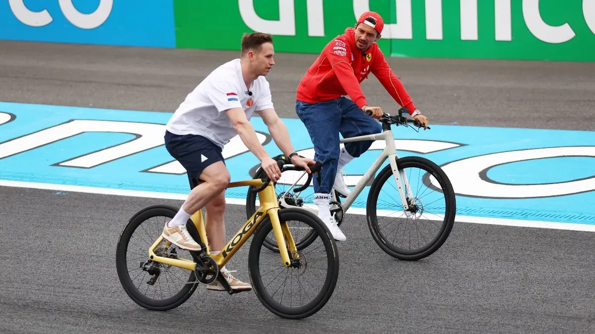 Charles Leclerc rides a cycle on the Zandvoort circuit