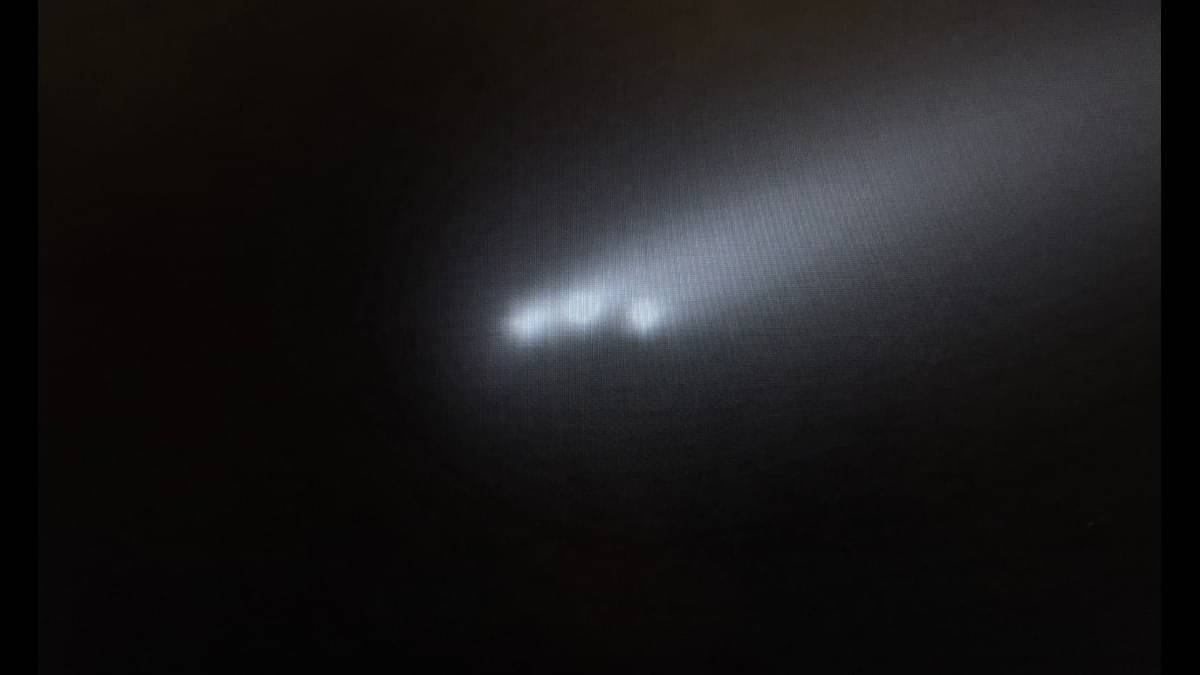 Comet dramatically breaks up into three brighter parts