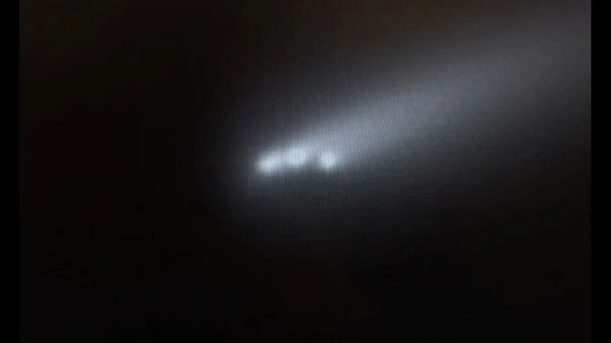 Comet dramatically breaks up into three brighter parts