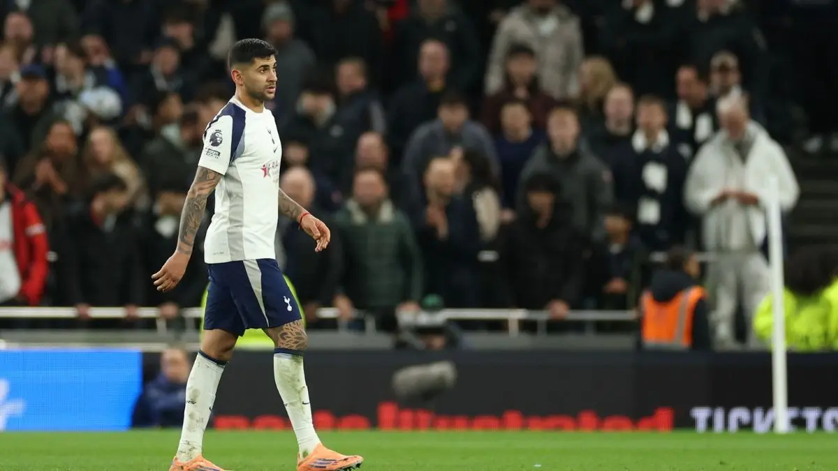 Cristian Romero walking off after red card