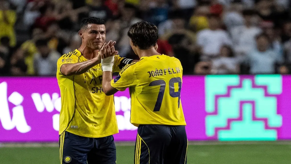Cristiano Ronaldo celebrates a goal with Joao Felix
