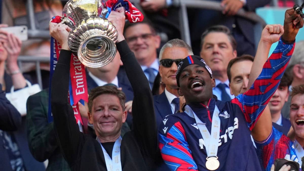 Crystal Palace's head coach Oliver Glasner raises the trophy after his team won the English FA Cup final