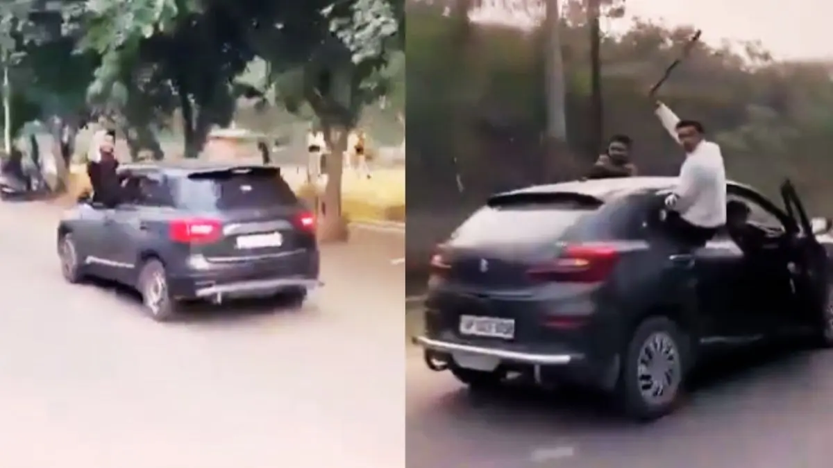 dangerous stunt on road in moving car