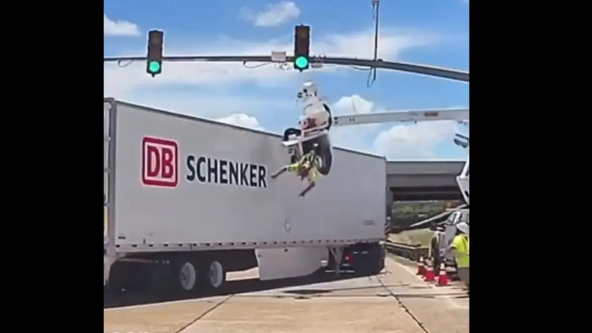 Watch: Worker Tossed Into Midair, Left Dangling from Crane After Being Hit by 18-Wheeler Dashcam footage of a worker tossed midair, left dangling from crane