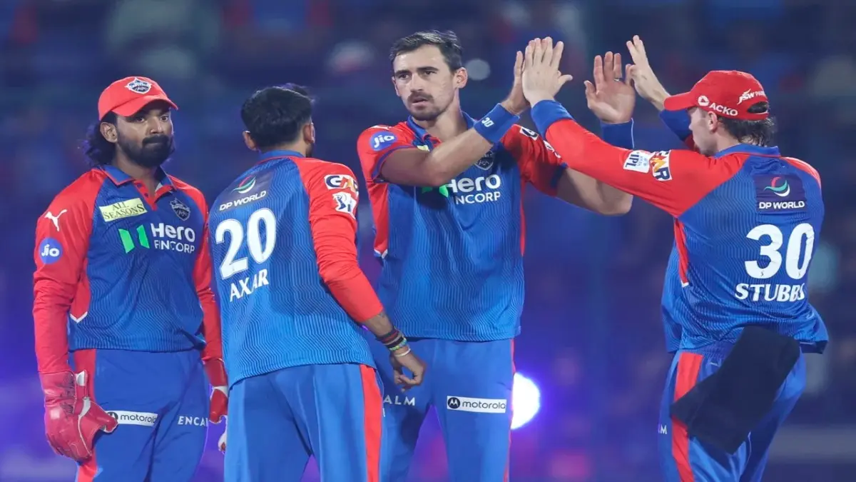 Delhi Capitals players celebrate a wicket
