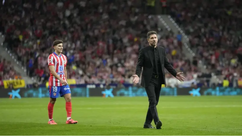 Madrid soccer derby interrupted after Atletico fans throw objects on the field Diego Simeone