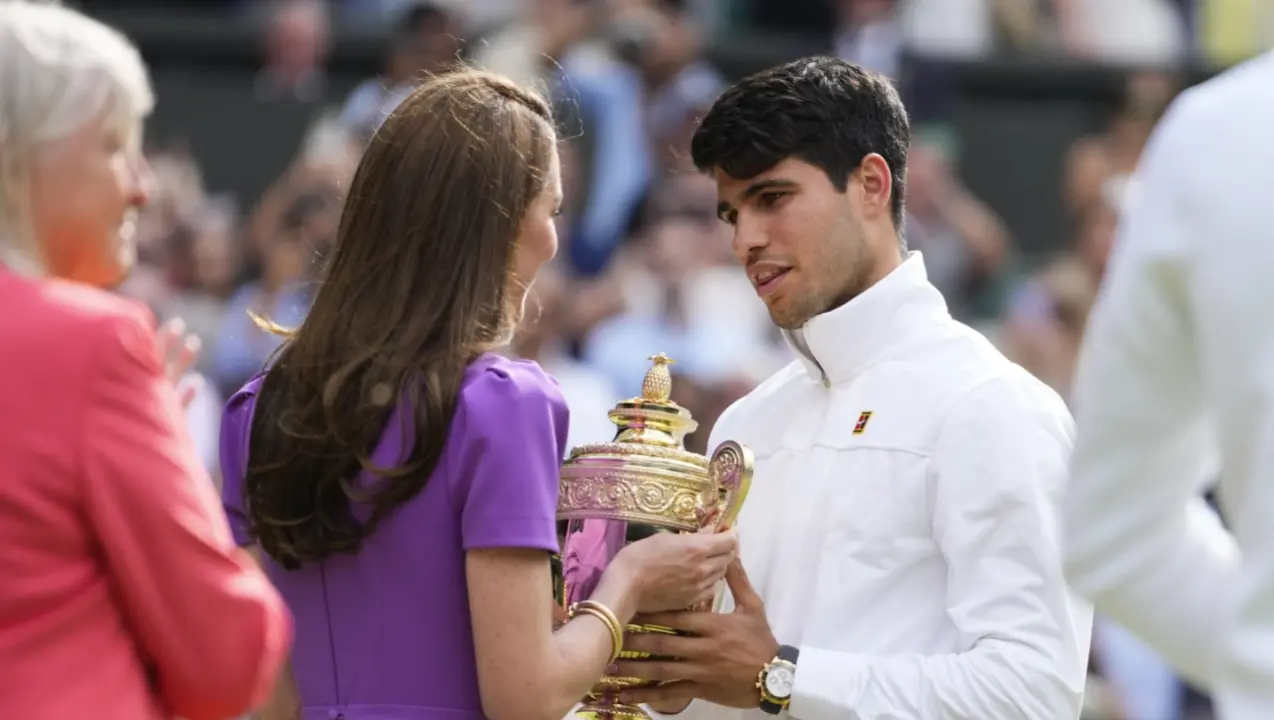 Kate, the Princess of Wales, hands Carlos Alcaraz his Wimbledon trophy in a rare appearance for her Carlos Alcaraz