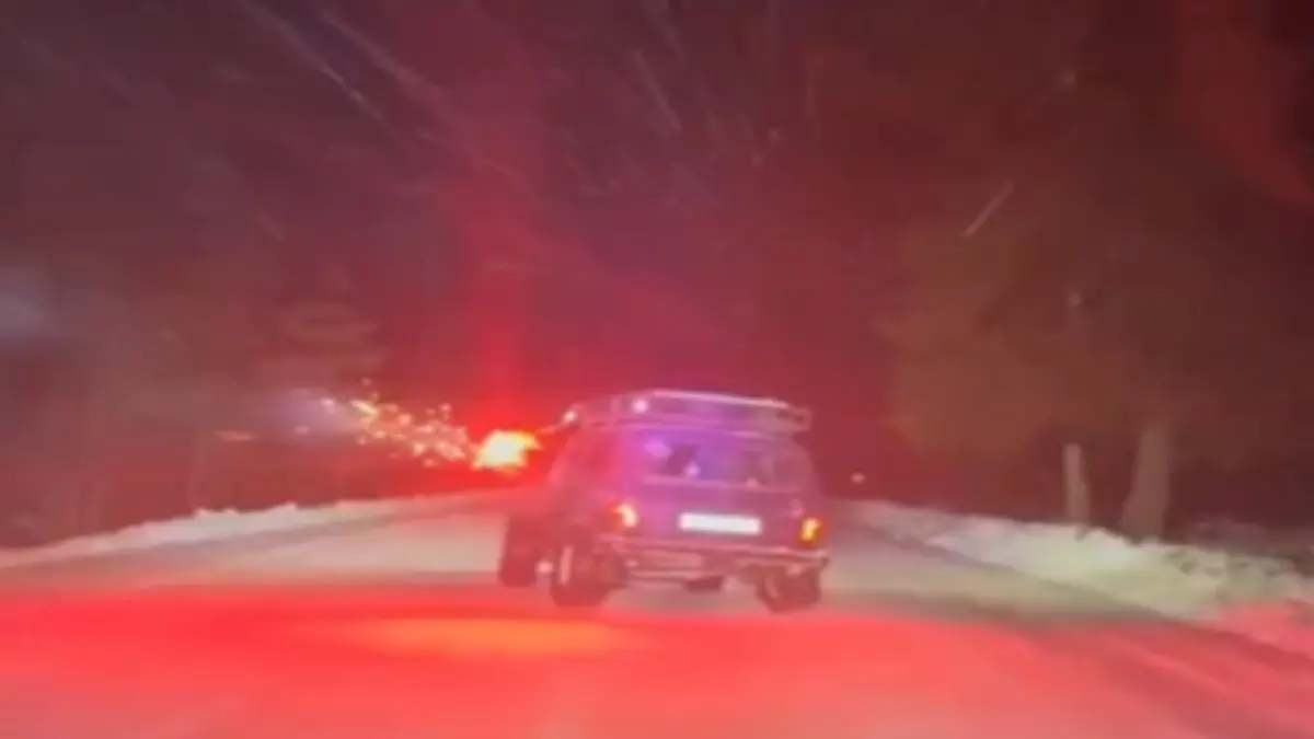 Russian friends launch fireworks in front of moving vehicles