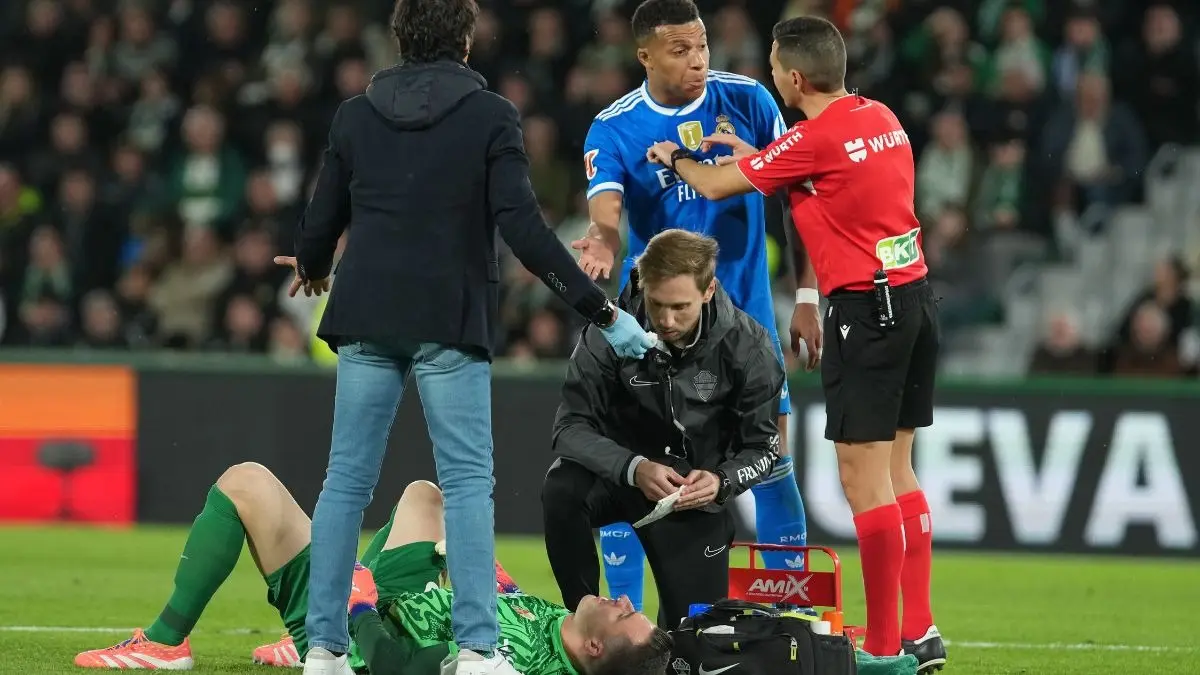 Elche's goalkeeper Inaki Pena lies on the pitch after a challenge
