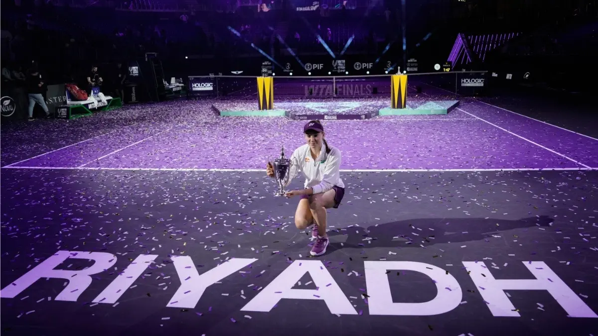 Elena Rybakina poses with the trophy after defeating Aryna Sabalenka in the women's final singles match of the WTA Finals