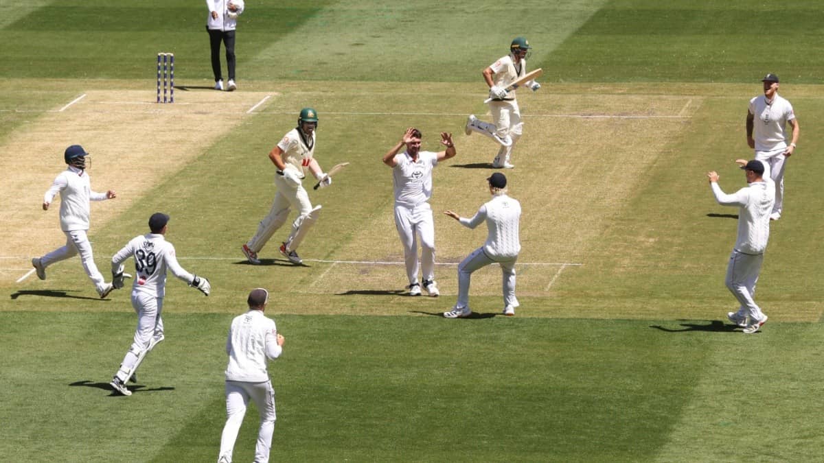 England players celebrate the wicket of Australia's Scott Boland, center left, during the Ashes Series in Melbourne