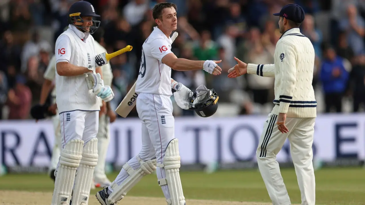 England's Jamie Smith is greeted by India's captain Shubman Gill (R) after England won the first Test match against India at Headingley.