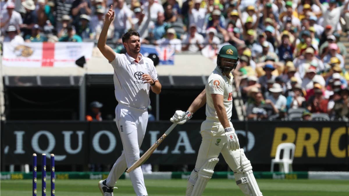 England's Josh Tongue, left, celebrates bowling Australia's Michael Neser, right, during the ongoing Melbourne Test
