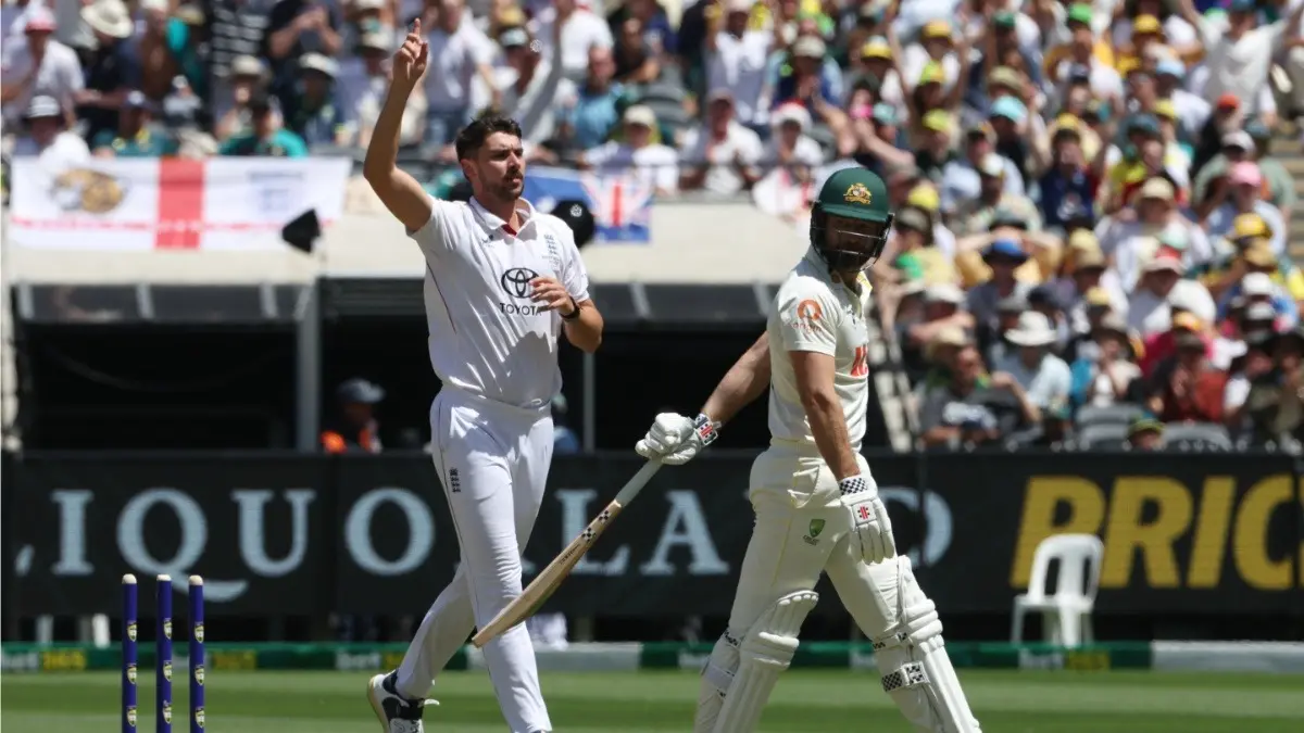 England's Josh Tongue, left, celebrates bowling Australia's Michael Neser, right, during the ongoing Melbourne Test