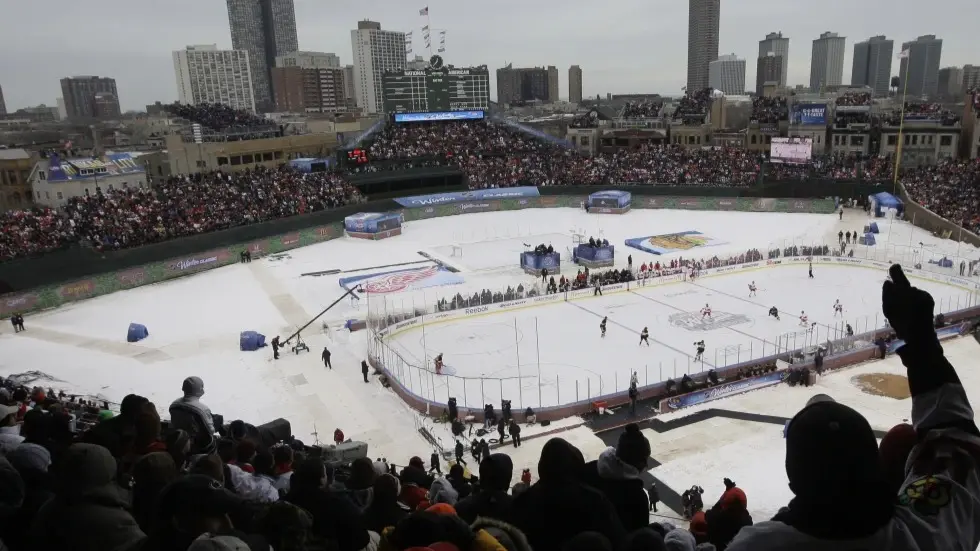 Wrigley Field will host a pair of college hockey doubleheaders after NHL's Winter Classic Fans cheer during the first period of the NHL Winter Classic hockey game
