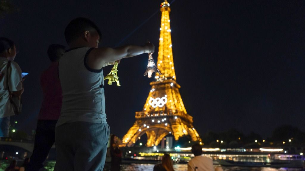 Fans in Paris soak in the Olympic Rings at Eiffel Tower just a week prior to Olympics