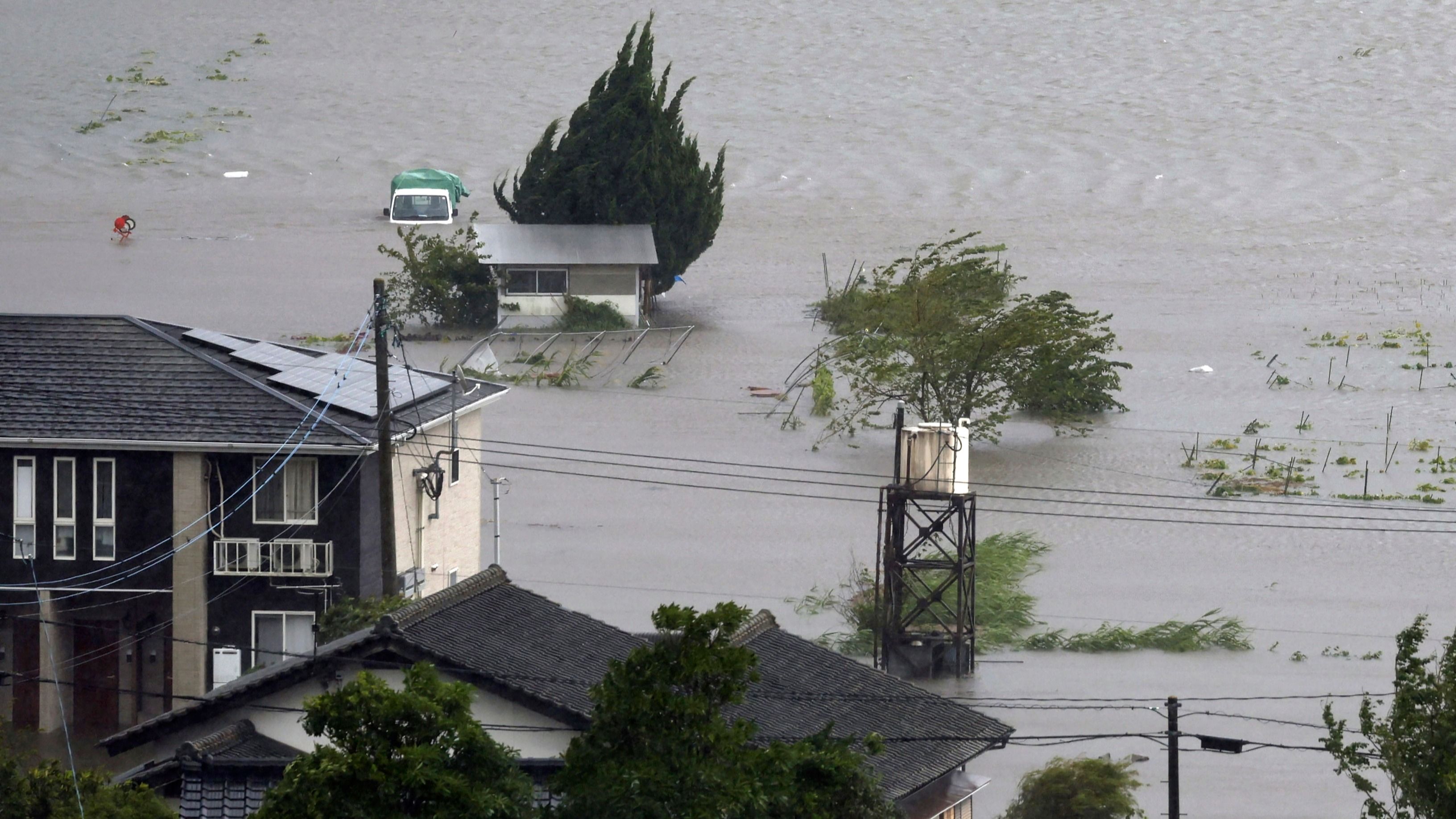 Typhoon Lashes Japan with Torrential Rain and Strong Winds on a Slow ...