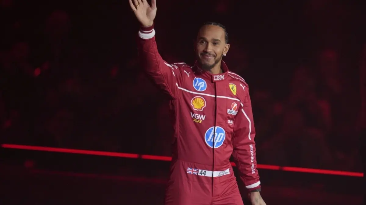 Ferrari driver Lewis Hamilton waving at fans