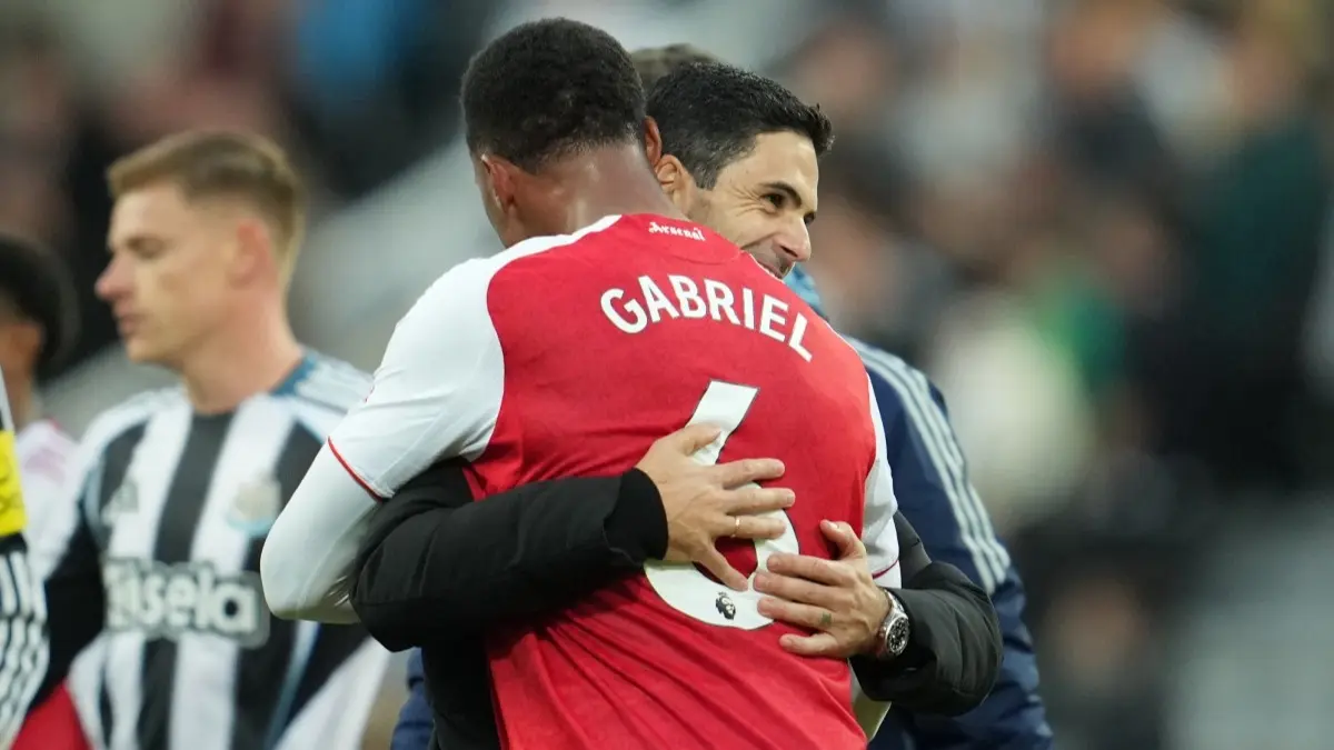 Gabriel and Mikel Arteta celebrate Arsenal's win against Newcastle United