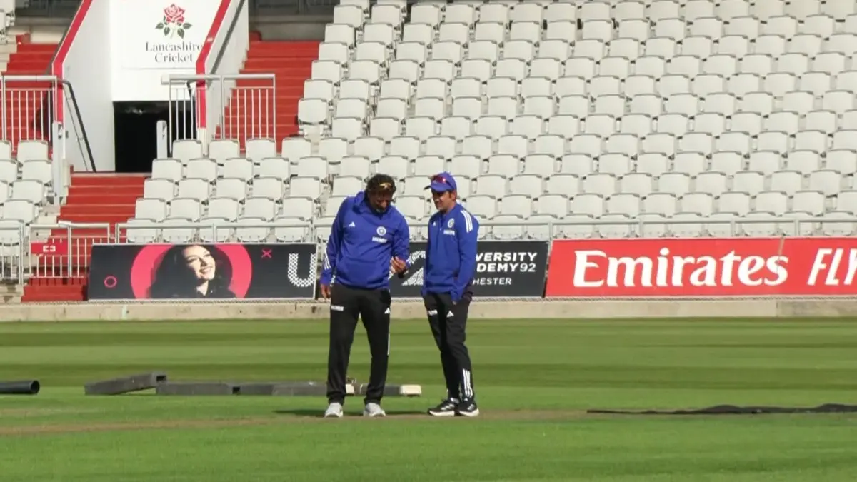 Gautam Gambhir and Sitanshu Kotak inspect the Manchester pitch