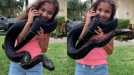 Girl Lifts Huge Snake