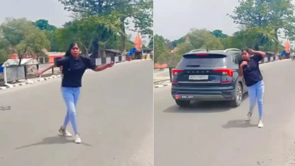 Girl makin reel on the road when a speeding car