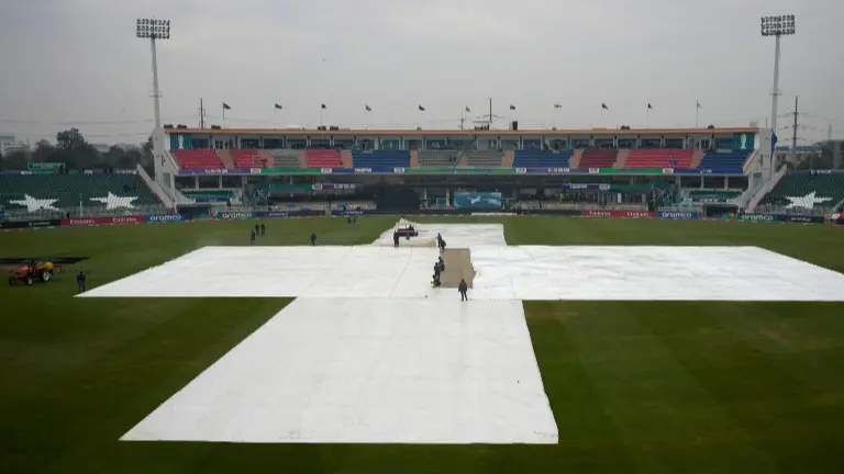 PCB's Incompetency Leads To First Washout Of CT 2025, AUS vs SA Called Off Due To Substandard Infrastructure In Rawalpindi Groundsmen cover the pitch at Rawalpindi Cricket Stadium