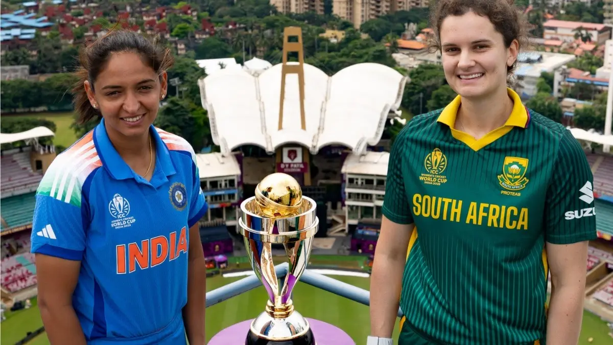 Harmanpreet Kaur and Laura Wolvaardt pose with Women's World Cup trophy in Navi Mumbai