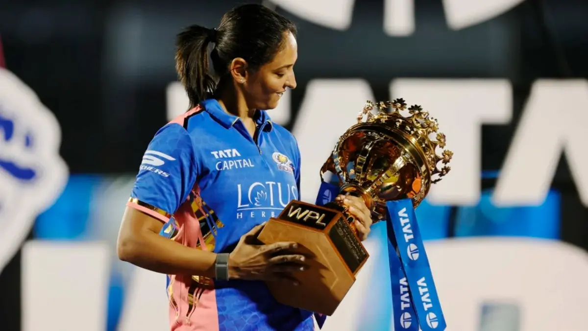 Harmanpreet Kaur with the WPL trophy