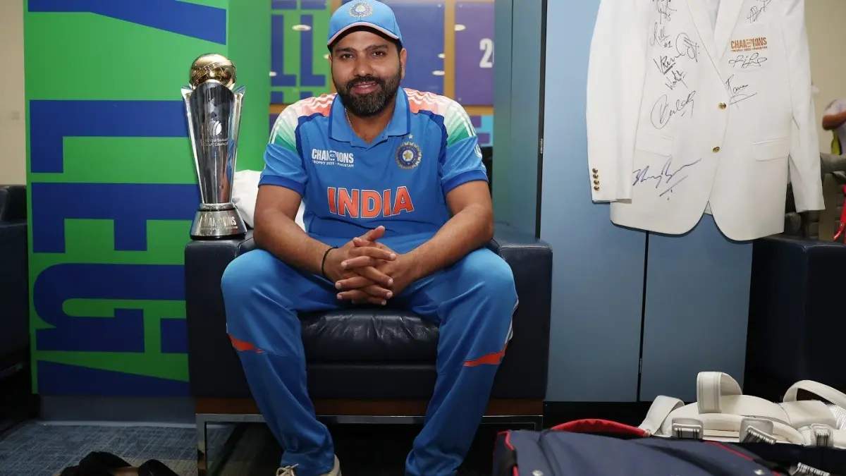 India's captain Rohit Sharma poses with the Champions Trophy trophy