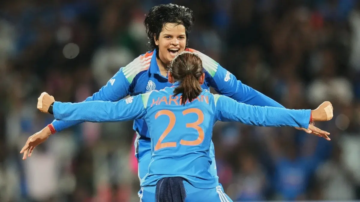 India's Harmanpreet Kaur and Shafali Verma celebrate the dismissal of South Africa's Sune Luus at the Women's World Cup 2025 Final