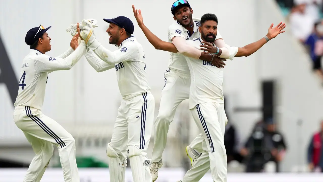India's players celebrate their win against England on day five of the fifth cricket test match