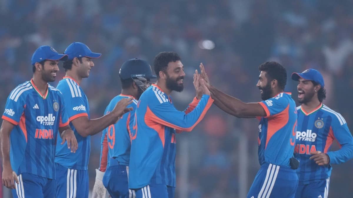 India's Varun Chakaravarthy celebrates with his teammates after taking a wicket against South Africa in the 5th T20I