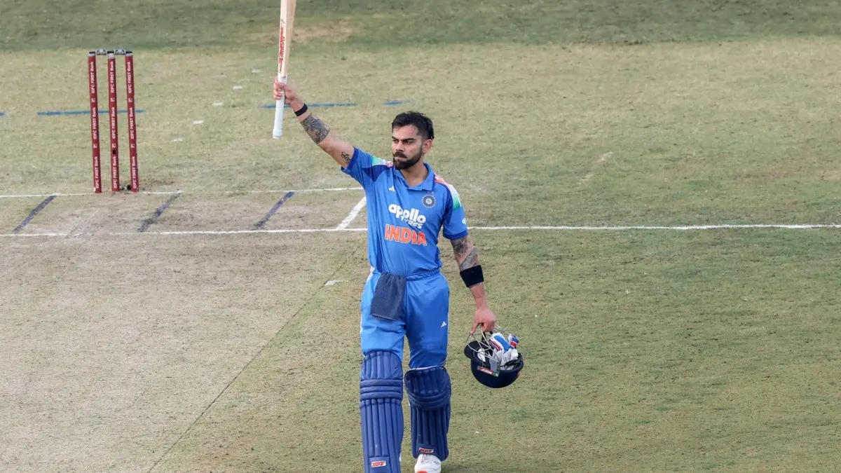 India's Virat Kohli raises his bat as he celebrates his century during the first ODI against South Africa