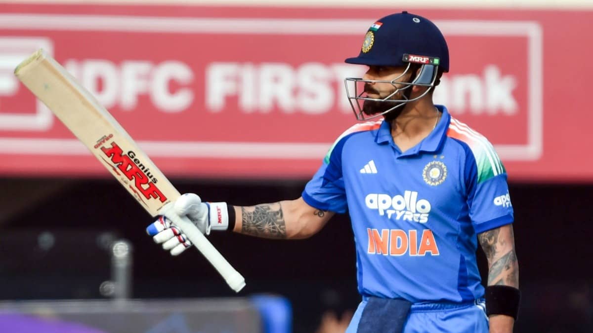 India's Virat Kohli raises his bat as he celebrates his half-century during the first ODI match against South Africa