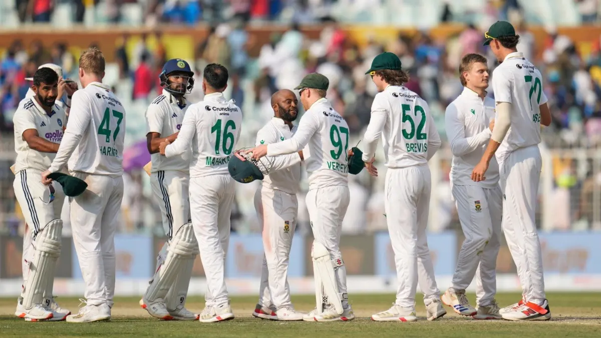 Indian and South African players shake hands after the end of the Kolkata Test