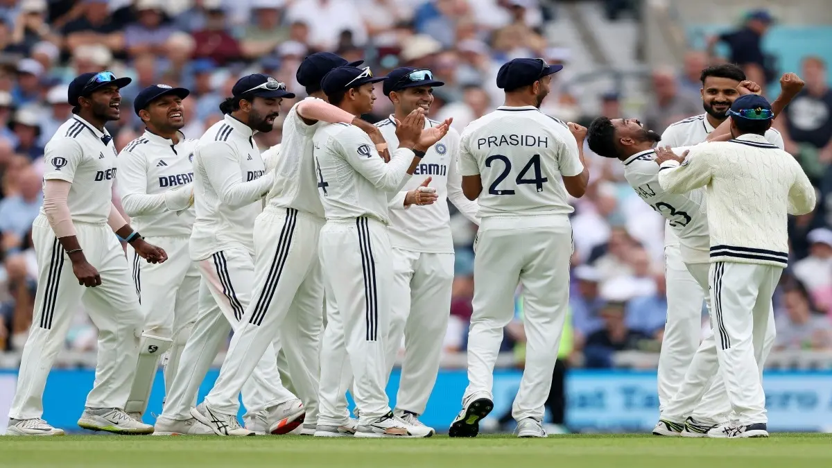 Indian players celebrate a England wicket