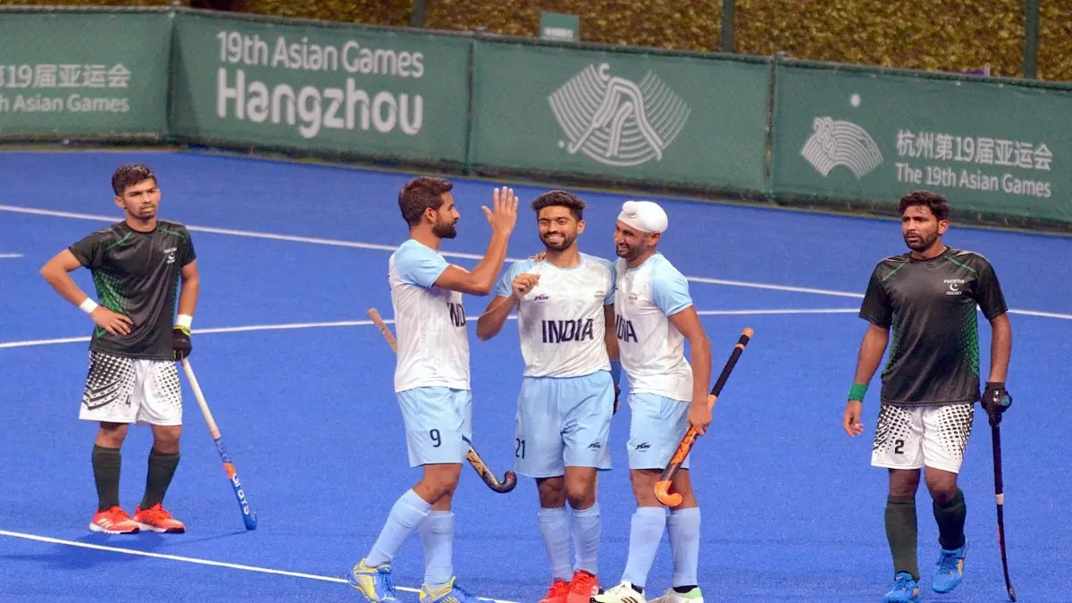 Indian players celebrate a goal against Pakistan