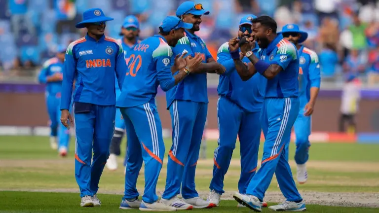 Indian players celebrate a wicket