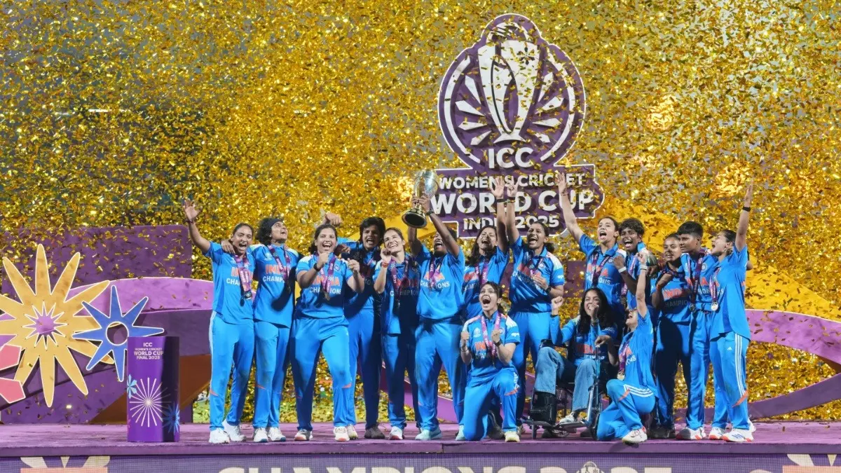 Indian players celebrate with the trophy after their win over South Africa in the ICC Women's Cricket World Cup final match
