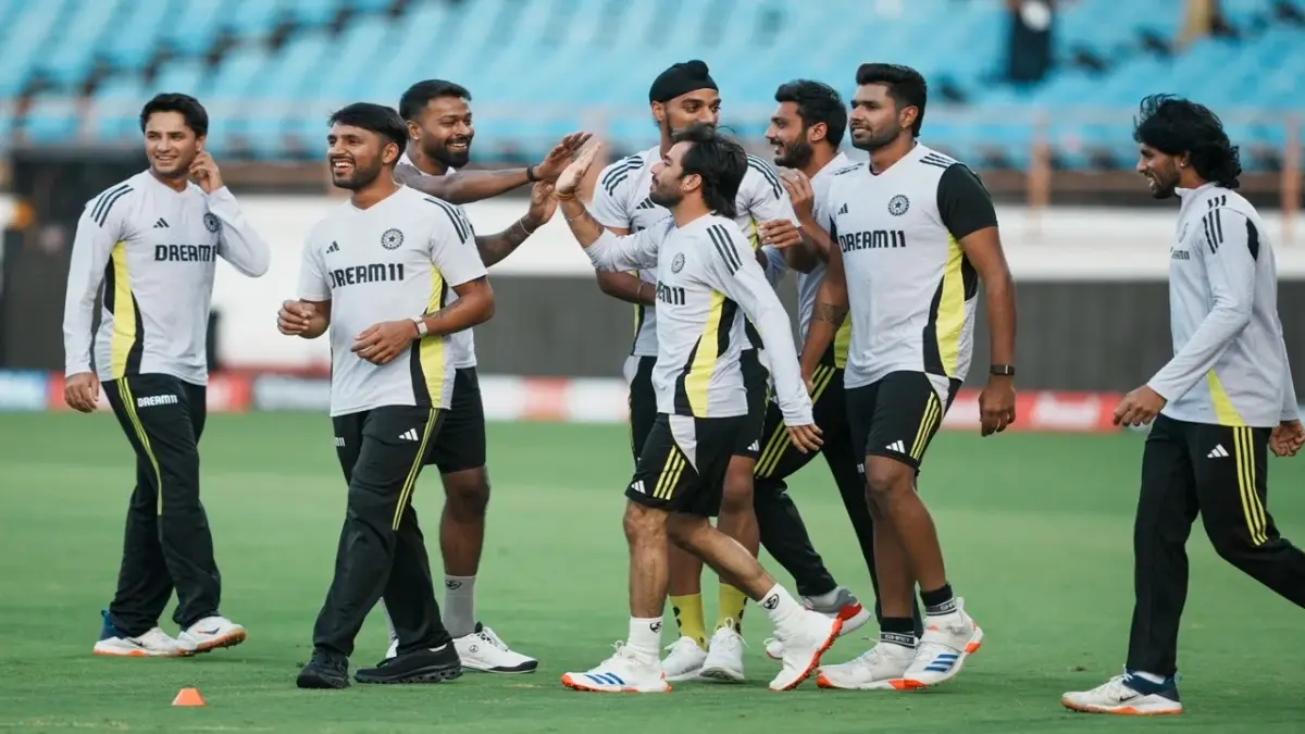 Indian players share a light moment during practice