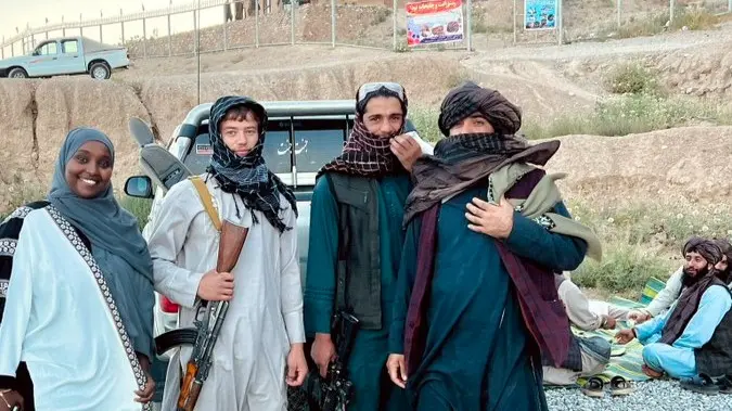 Germany Deports 28 Afghan Nationals to Their Homeland, 1st Since the Taliban Takeover in 2021 Influencer poses with Taliban