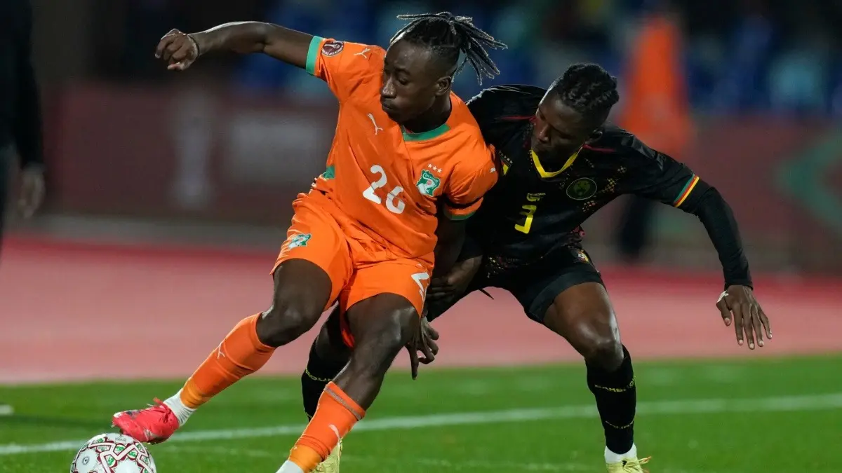 Ivory Coast's Yan Diomande and Cameroon's Junior Che Malone in the Africa Cup of Nations Group F match