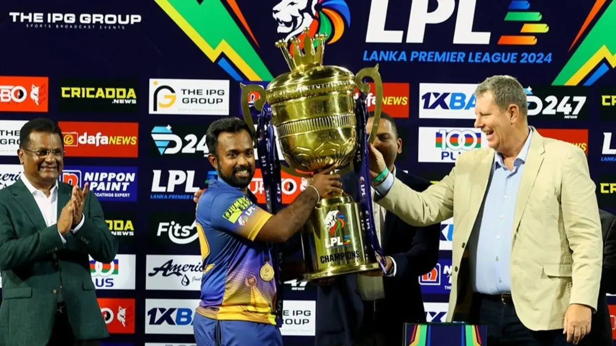 Jaffna Kings skipper receiving trophy after winning LPL 2024