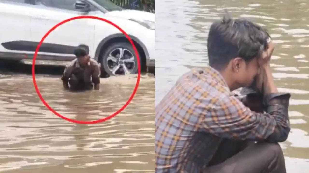 Jaipur man cries after losing phone on waterlogged road.