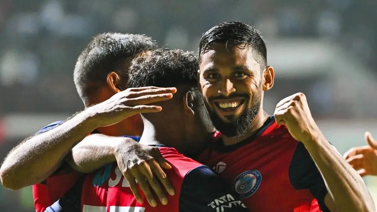 Jamshedpur FC players celebrate a goal