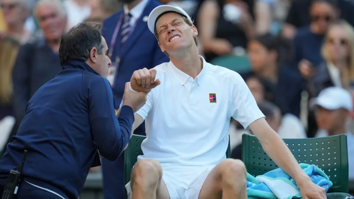 Jannik Sinner receives medical treatment during fourth round match at the Wimbledon 2025