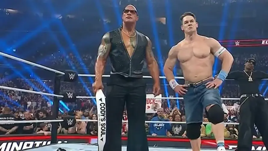 WWE Elimination Chamber Results: John Cena Turns HEEL, Sells Out To The ROCK And Attacks Cody Rhodes John Cena and The Rock stand atop Cody Rhodes